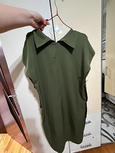 qara donlar: Qadın paltarı – zeytun-yaşıl rəngdə, düz kəsim, dizə yaxın uzunluq. - — 2