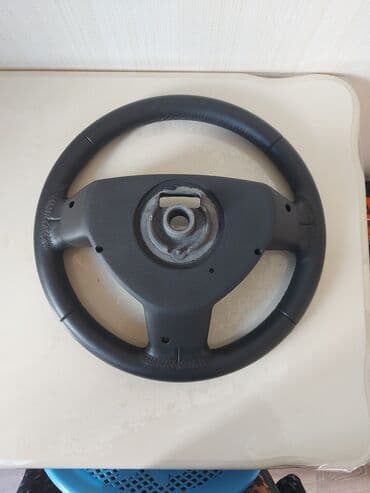 multi kar: Məhsul: Avtomobil sükanı - Material: qara dəri üzlü örtük, tikişli — 1