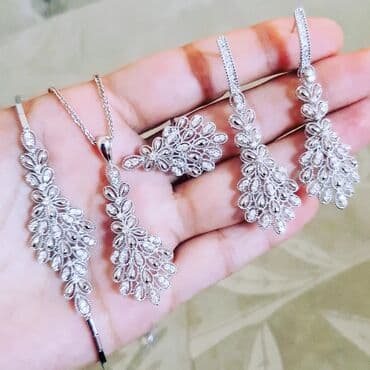 1 qram qızılın qiyməti 2024 750: Dəstə daxildir: Sırğa, Üzük, Bilərzik, Ağ qızıl, 750 Əyar, 2415 g — 2