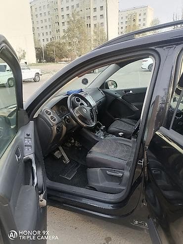 mercedes e 2: Volkswagen Tiguan: 2 l | 2009 il Ofrouder/SUV — 5