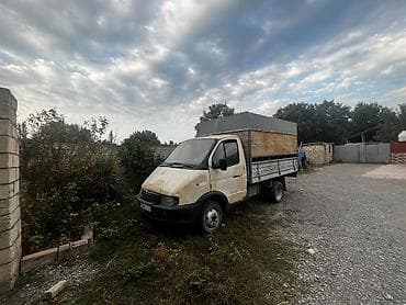qubada traktor satisi: Yük daşımaq üçün bortlu yük avtomobili. Avtomobil açıq platformalı — 1