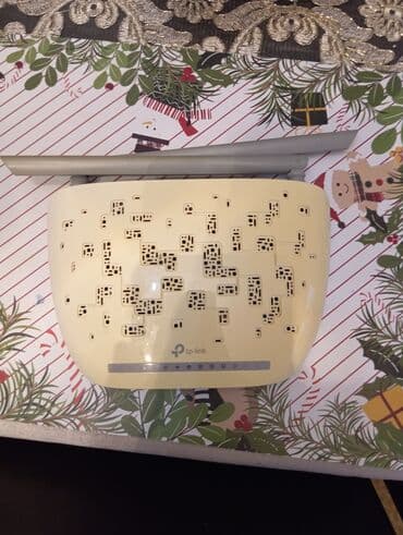 ruter modem: TP-Link şirkətinin istehsalı olan, iki antenli ağ ruter. Evdə və ya — 4