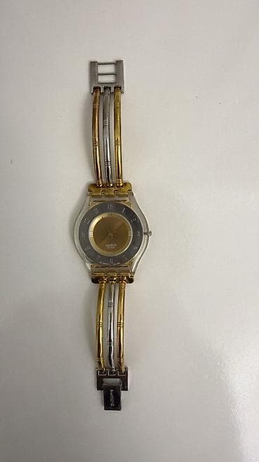 saat qolbaqlari: Qol saatı, Swatch, rəng - Qızılı — 3