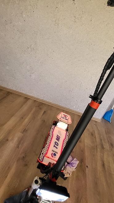 ucuz gitara: Elektrik skuter – TOMI brendi Xüsusiyyətlər: - Güclü ikili — 6