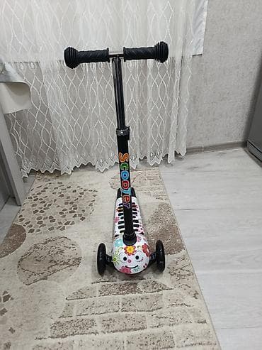 elekdirikli sukutur: Uşaq skuteri – 3 təkərli, çiçək naxışlı model,hec istifade edilmeyib — 5