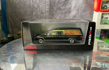 metbex tavan modelleri: Коллекционная модель Mercedes-Benz 200 W123 Hearse black 1982 Schuco — 3