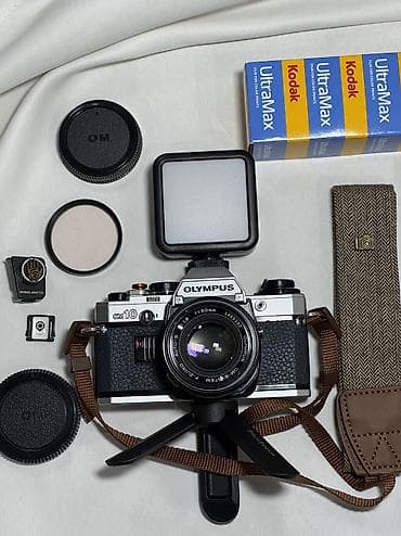 fotokamera: 1979-cu il Yaponiya istehsalı. Olympus OM 10 35 mm film ilə işləyən — 7
