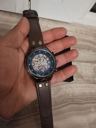 Mexaniki skelet saat - Üzü: mavi halqalı skelet dizaynı, rom rəqəmlər — 1