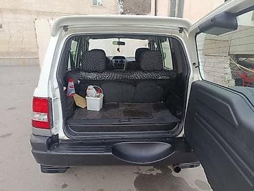 Mitsubishi: Mitsubishi Pajero iO (5 qapı) SUV - Kuzov: ağ/gümüş iki rəngli, yan — 3