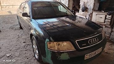 Audi A6 sedan təqdim olunur. Avtomobil tünd rəngdədir, 4 qapılı кузов lalafo.az -da Audi A6 sedan təqdim olunur. Avtomobil tünd rəngdədir, 4 qapılı кузов