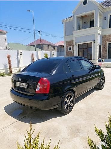 multi sukan: Hyundai Accent: 1.4 l | 2008 il Sedan — 9