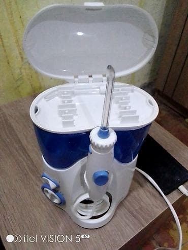 şirin su aparati: Stasionar ağız duşu (irrigator) - Su çəni: iri həcimli, mavi şəffaf — 4