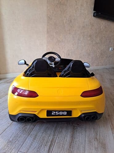 детский мотоцикл каталка: Uşaq üçün elektrikli ride-on avtomobil – sarı rəngdə sport kabriolet — 7