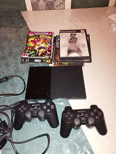 Sony PlayStation 2 Slim komplekti Tərkib: - PS2 Slim (qara) - 2 ədəd — 3