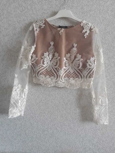 yupqa kofta: Naxışlı ağ krujeva detalları olan bej rəngli qısa kofta. 34 razmerə — 4