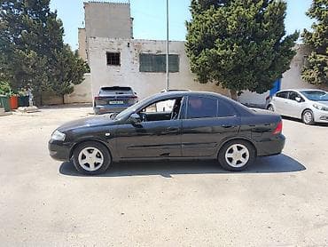 mini canta: Nissan Sunny: 1.6 l | 2008 il Sedan — 3