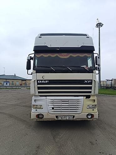 DAF XF dartqı (traktor) və tentli qoşqu • Marka/model: DAF XF •