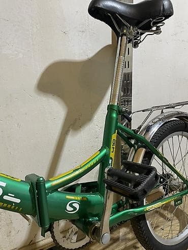 vele: STELS qatlanan velosiped. Yaşıl rəngli, kompakt ölçülü şəhər tipli — 4