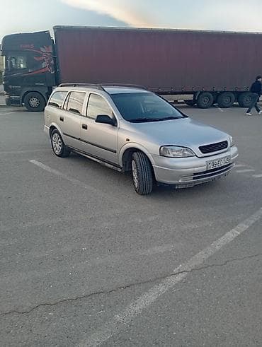 yuk baqajı: Opel Astra Caravan (universal) – gümüş rəng • Kuzov: universal (5 — 1