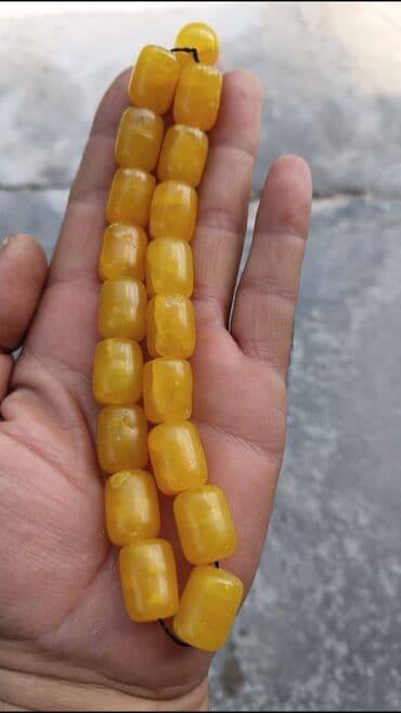 1 qram gumusun qiymeti 2022: Sarı rəngli, çəllək formalı kəhrəba muncuqlarından ibarət təsbeh — 1