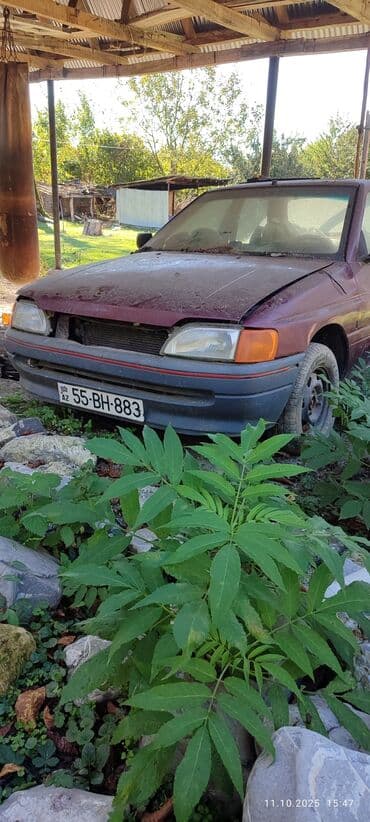 запчасти на форд фокус 1: Ford Orion sedan – 4 qapı, bənövşəyi/qırmızı rəng. Nömrə: 55-BH-883 — 3
