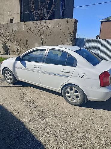 kia clarus 1997: Hyundai Accent: 1.6 l | 2009 il Sedan — 4