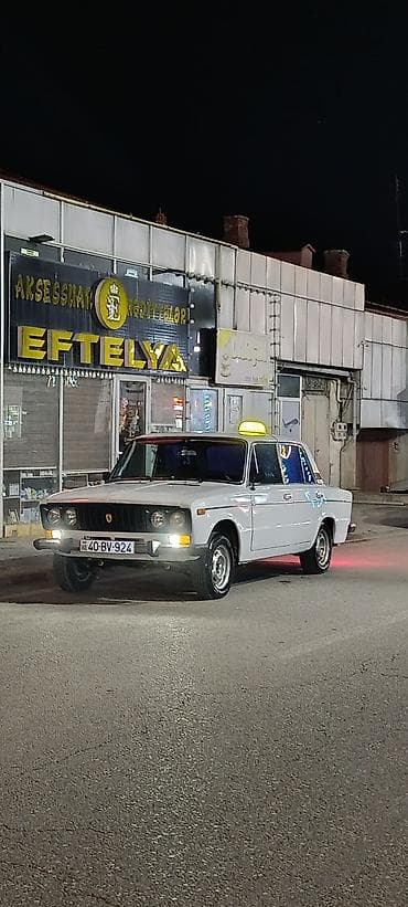 VAZ 2106 – klassik sedan, ağ rəngli, 4 qapı, arxa ötürücülü. Əsas