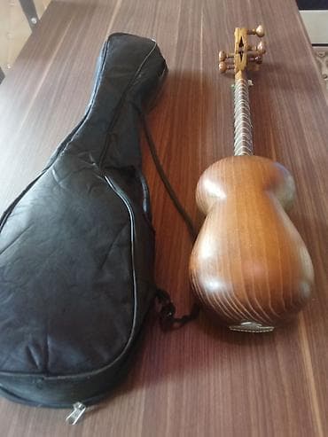 tar instrument: Tar – klassik Azərbaycan musiqi aləti, yumru gövdəli, dəri ilə örtülü — 2