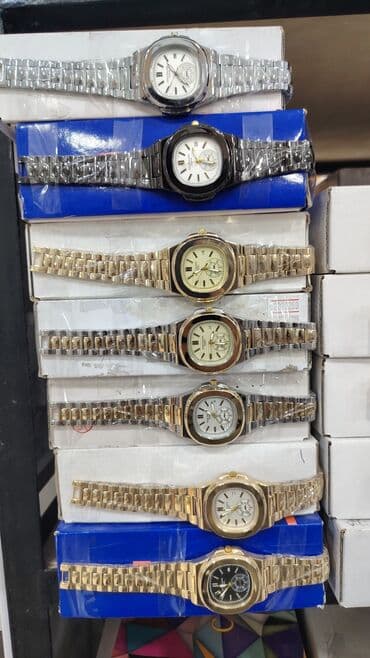 kişi ucun qızıl uzuk: Qol saatı, Patek Phillipe — 1