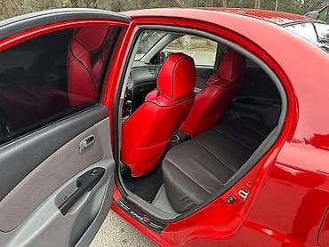 kia optima oluxanasi: Kia Rio sedan – qırmızı rəng, 4 qapı, kompakt şəhər avtomobili. - — 5