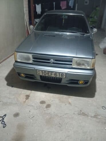 işlənmiş radiatorlar: Model: Tofaş Şahin/Doğan (sedan) Kuzov: 4 qapılı, boz rəng Nömrə: AZ — 1