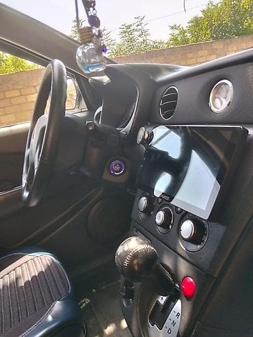 e39 radiator: Mitsubishi (Airtrek/Outlander ilk nəsil) krossover, ağ rəng. Xarici — 5