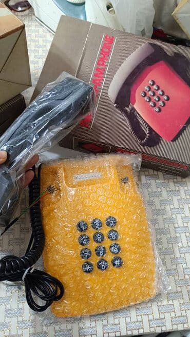 Stasionar telefon Simli