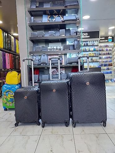 Çamadanlar: Sərnişin çamadan dəsti – 3 ölçü - Rəng: qara, dairəvi relyefli dizayn — 1