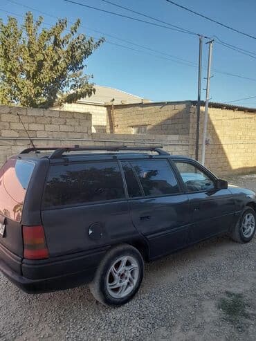 yuk masini sifarisi: Opel Astra F Universal (kombi) – 5 qapılı, qara rəng. - Kuzov — 5