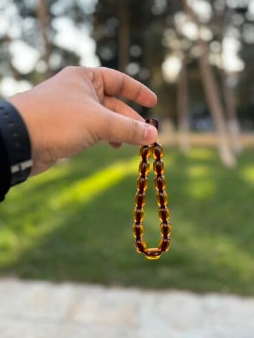 xari bulbul simvolu: Ateş kəhraba - Material: şəffaf, qəhvəyi-kehraba. Üstündəki osmanlı — 1