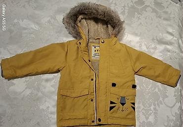 Uşaq dünyası: Uşaq üçün qış gödəkçəsi - Rəng: sarı/xardal - Ölçü etiketi: “Nursery — 1