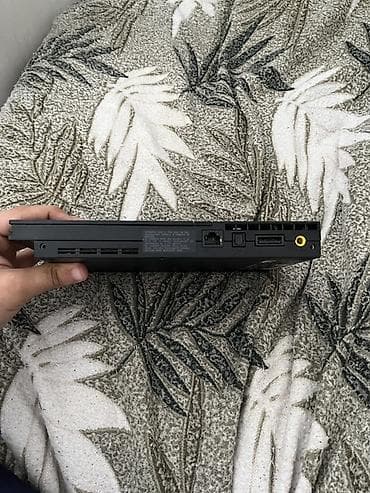 PlayStation 2 Slim (SCPH seriyası) oyun konsolu Xüsusiyyətlər: - — 3
