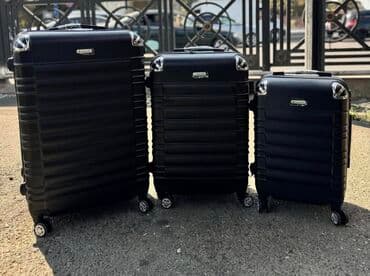 Maskalar, eynəklər: Fərqli ölçülərdə üç ədəd qara rəngli səyahət çantası dəsti. Hər bir — 1