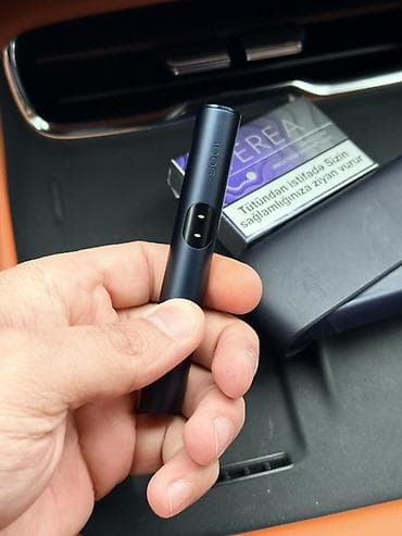 ağ sarocka: Göylə rəngdə IQOS tütün isitmə cihazı, uyğun saxlama qutusu və Terea — 2