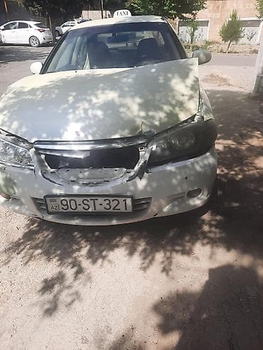 megan 3: Nissan Sunny: 1.3 l | 2006 il Sedan — 3