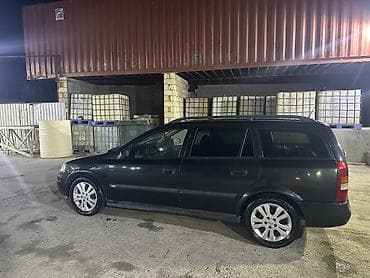 stanqa: Opel Astra Caravan (universał) – qara rəng, 5 qapı, geniş baqajlı ailə — 4