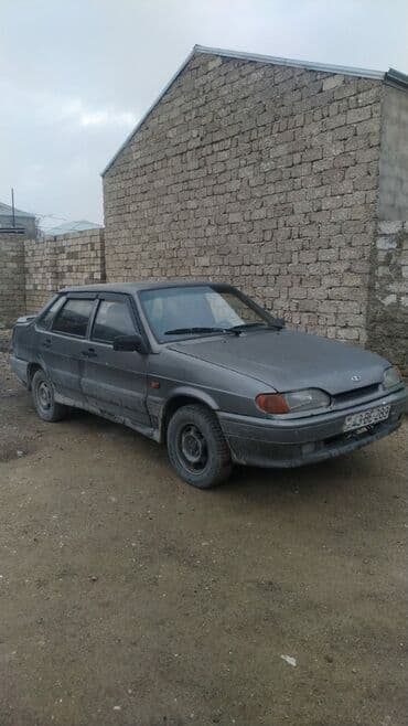 lada qapi: Tünd boz rəngli sedan tipli avtomobil. Arxa tərəfində spoyler — 7