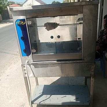 grill aparati: Paslanmayan poladdan hazırlanmış şişli toyuq çevirəni (rotisseri) — 1