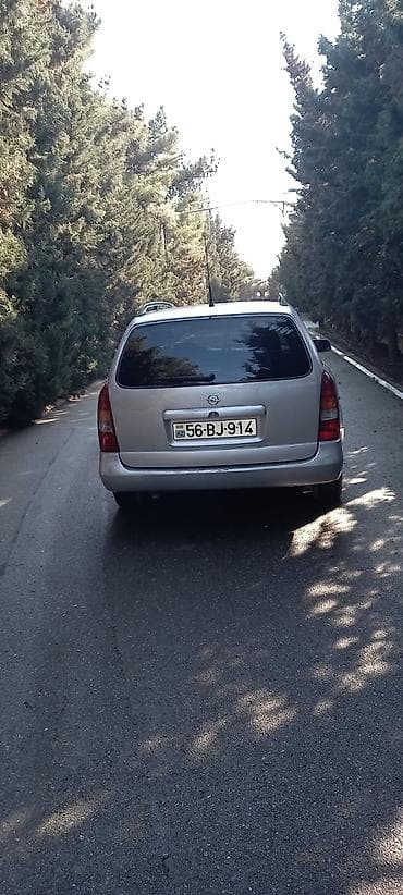 opel astra baqaj: Opel Astra Caravan (universał) – gümüşü rəngli, 5 qapılı ailə və — 2