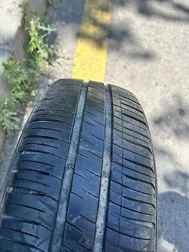 l200 disk: Michelin markalı avtomobil şini. Ölçüsü: **185/70 R14** Yük/sürət — 1