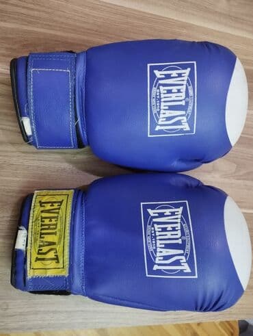 боксерская груша купить в баку: Mavi rəngdə "Everlast" markalı, 16 unsiya ölçüsündə boks əlcəkləri. Bu — 2