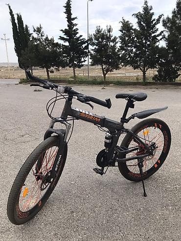 STRIM dağ velosipedi — qatlanan gövdə və tam asqı sistemi ilə rahat və