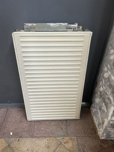 su radiatoru ev ucun: Ataplenni evden sokulub — 1