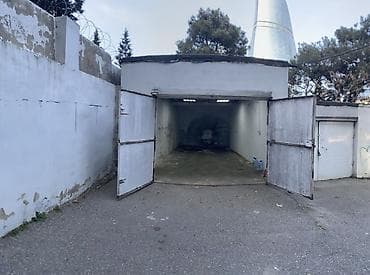 Avtodayanacaq/qapalı qaraj - Yerləşmə: Milli Məclisin yanı İzzət